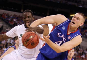 INDIANAPOLIS - MARCH 27:  Draymond Green #23 of the Michigan State Spartans fights for control of the ball against Cole Aldrich #45 of the Kansas Jayhawks during the third round of the NCAA Division I Men's Basketball Tournament at the Lucas Oil Stadium on March 27, 2009 in Indianapolis, Indiana.  (Photo by Andy Lyons/Getty Images)