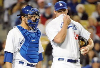 LOS ANGELES, CA - APRIL 16:  Eric Stults #50 of the Los Angeles Dodgers speaks to Russell Martin #55 during the game against the San Francisco Giants at Dodger Stadium on April 16, 2009 in Los Angeles, California.  (Photo by Harry How/Getty Images)