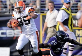 BALTIMORE - SEPTEMBER 21:  Jerome Harrison #35 of the Cleveland Browns breaks a tackle by Ed Reed #20 of the Baltimore Ravens and scores a touchdown September 21, 2008 at M&T Bank Stadium in Baltimore, Maryland.  (Photo by Greg Fiume/Getty Images)