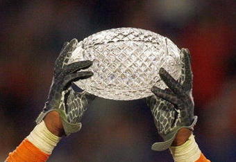 MIAMI - JANUARY 08:  Brandon Spikes #51 of the Florida Gators holds up the winning trophy after the FedEx BCS National Championship Game against the Oklahoma Sooners at Dolphin Stadium on January 8, 2009 in Miami, Florida.  (Photo by Eliot J. Schechter/Getty Images)