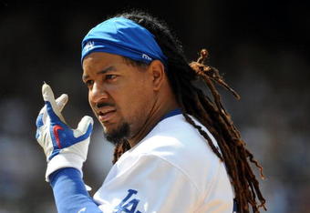 LOS ANGELES, CA - APRIL 19:  Manny Ramirez #99 of the Los Angeles Dodgers on base against the Colorado Rockies during the game at Dodger Stadium on April 19, 2009 in Los Angeles, California.  (Photo by Harry How/Getty Images)