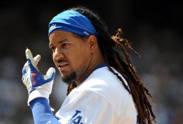 LOS ANGELES, CA - APRIL 19:  Manny Ramirez #99 of the Los Angeles Dodgers on base against the Colorado Rockies during the game at Dodger Stadium on April 19, 2009 in Los Angeles, California.  (Photo by Harry How/Getty Images)
