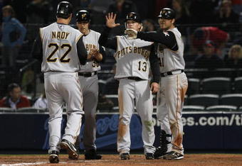 ATLANTA - MARCH 31: Right fielder Xavier Nady #22 of the Pittsburgh Pirates is greeted by teammates Jason Bay #38, Nate McLouth #13 and Ryan Doumit #41 after his 12th inning 3-run home run during the game against the Atlanta Braves at Turner Field March 31, 2008 in Atlanta, Georgia.  The Pirates won 12-11 in 12 innings. (Photo by Mike Zarrilli/Getty Images)