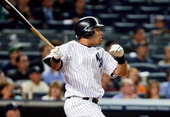 NEW YORK - JUNE 30: Melky Cabrera #53 of the New York Yankees hits a sacrifice fly against the Seattle Mariners June 30, 2009 at Yankee Stadium in the Bronx borough of New York City.  (Photo by Mario Tama/Getty Images)