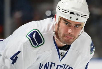 UNIONDALE, NY - NOVEMBER 17: Rob Davison #4 of the Vancouver Canucks takes part in warmups prior to his game against the New York Islanders on November 17, 2008 at the Nassau Coliseum in Uniondale, New York. (Photo by Bruce Bennett/Getty Images)