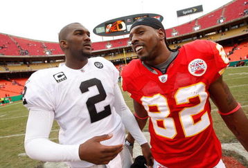 KANSAS CITY, MO - SEPTEMBER 14:  Former LSU teammates Dwayne Bowe #82 of the Kansas City Chiefs and JaMarcus Russell #2 of the Oakland Raiders share a word after their NFL game at Arrowhead Stadium on September 14, 2008 in Kansas City, Missouri. The Raiders defeated the Chiefs 23-8. (Photo by Jamie Squire/Getty Images)