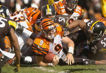 PITTSBURGH, PA - SEPTEMBER 24:  Carson Palmer #9 of the Cincinnati Bengals is tackled during the NFL game against the Pittsburgh Steelers on September 24, 2006 at Heinz Field in Pittsburgh, Pennsylvania. The Bengals won the game 28-20.  (Photo by Greg Fiume/Getty Images) 