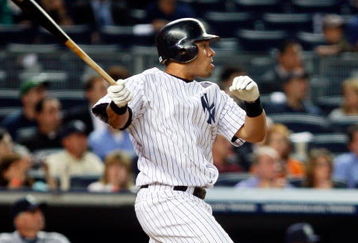 NEW YORK - JUNE 30: Melky Cabrera #53 of the New York Yankees hits a sacrifice fly against the Seattle Mariners June 30, 2009 at Yankee Stadium in the Bronx borough of New York City.  (Photo by Mario Tama/Getty Images)