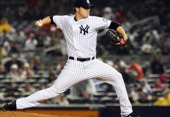 NEW YORK - MAY 04:  Phil Hughes #65 of the New York Yankees pitches against the Boston Red Sox on May 4, 2009 at Yankee Stadium in the Bronx borough of New York City. The Red Sox defeated the Yankees 6-4 (Photo by Jim McIsaac/Getty Images)