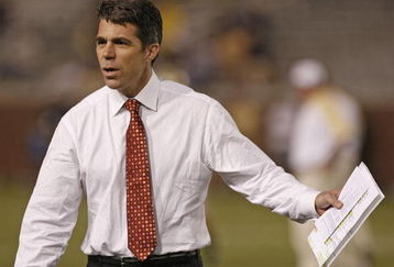 ATLANTA - NOVEMBER 1: ESPN commentator Chris Fowler talks with coaches before the game between the Georgia Tech Yellow Jackets and the Virginia Tech Hokies on November 1, 2007 at Bobby Dodd Stadium at Historic Grant Field in Atlanta, Georgia.  The Hokies beat the Yellow Jackets 27-3.  (Photo by Mike Zarrilli/Getty Images)