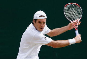 WIMBLEDON, ENGLAND - JUNE 29:  Tommy Haas of Germany plays a backhand during the men's singles third round match against Igor Andreev of Russia on Day Seven of the Wimbledon Lawn Tennis Championships at the All England Lawn Tennis and Croquet Club on June 29, 2009 in London, England.  (Photo by Paul Gilham/Getty Images)