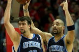 HOUSTON - APRIL 29:  Mehmet Okur #13 and Carlos Boozer #5 of the Utah Jazz lobby unsuccessfully for an offensive goaltending call against the Houston Rockets in Game Five of the Western Conference Quarterfinals during the 2008 NBA Playoffs at the Toyota Center on April 29, 2008 in Houston, Texas.  The Rockets won 95-69.   NOTE TO USER: User expressly acknowledges and agrees that, by downloading and or using this photograph, User is consenting to the terms and conditions of the Getty Images License Agreement. (Photo by Stephen Dunn/Getty Images)  