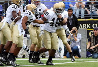 BALTIMORE - NOVEMBER 15:  Toryan Smith #49 of the Notre Dame Fighting Irish celebrates his first quarter touchdown with his teammates after he returned a blocked punt against the Navy Midshipmen on November 15, 2008 at M&T Bank Stadium in Baltimore, Maryland.  (Photo by Jim McIsaac/Getty Images)