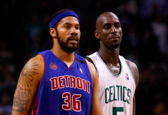 BOSTON - MAY 22:  Kevin Garnett # 5 of the Boston Celtics and Rasheed Wallace #36 of the Detroit Pistons look on during Game Two of the 2008 NBA Eastern Conference finals at the TD Banknorth Garden on May 22, 2008 in Boston, Massachusetts. NOTE TO USER: User expressly acknowledges and agrees that, by downloading and or using this photograph, User is consenting to the terms and conditions of the Getty Images License Agreement  (Photo by Jim Rogash/Getty Images)