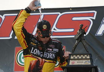 MEMPHIS, TN - JUNE 27: Ron Hornaday Jr., driver of the #33 Longhorn Chevrolet tries to cool down after winning the MemphisTravel.com 200 Camping World Truck Series race at the Memphis Motorsports Park on June 27, 2009 in Memphis, Tennessee.   (Photo by John Sommers II/Getty Images)