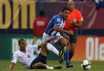 CHICAGO - JUNE 06: Amado Guevara #7 of Honduras collides with Ricardo Clark #2 of the United States as they pursue the ball during a FIFA 2010 World Cup Qualifying match on June 6, 2009 at Soldier Field in Chicago, Illinois. The United States defeated Honduras 2-1. (Photo by Jonathan Daniel/Getty Images)