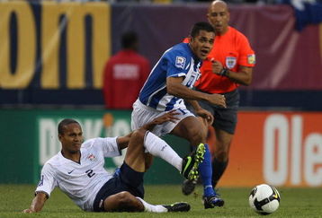 CHICAGO - JUNE 06: Amado Guevara #7 of Honduras collides with Ricardo Clark #2 of the United States as they pursue the ball during a FIFA 2010 World Cup Qualifying match on June 6, 2009 at Soldier Field in Chicago, Illinois. The United States defeated Honduras 2-1. (Photo by Jonathan Daniel/Getty Images)