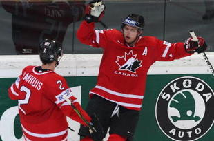 BERN, SWITZERLAND - MAY 07:  Dany Heatley of Canada celebrates with team-mate Dan Hamhuis after scoring during the IIHF World Championship Quarter-Final between Canada and Latvia at the PostFinance Arena on May 7, 2009 in Bern, Switzerland.  (Photo by Mike Hewitt/Getty Images)