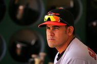 OAKLAND, CA - JUNE 07:  Oscar Salazar #26 of the Baltimore Orioles sits in the dugout before their game against the Oakland Athletics at the Oakland Coliseum on June 7, 2009 in Oakland, California.  (Photo by Ezra Shaw/Getty Images)