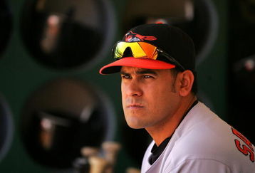 OAKLAND, CA - JUNE 07:  Oscar Salazar #26 of the Baltimore Orioles sits in the dugout before their game against the Oakland Athletics at the Oakland Coliseum on June 7, 2009 in Oakland, California.  (Photo by Ezra Shaw/Getty Images)