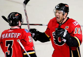 CALGARY, AB - APRIL 22: Jarome Iginla #12 and Dion Phaneuf #3 of the Calgary Flames celebrate Iginla's empty net goal to seal the win against the Chicago Blackhawks in Game Four of the Western Conference Quarterfinals of the 2009 Stanley Cup Playoffs on April 22, 2009 at the Pengrowth Saddledome in Calgary, Alberta, Canada. (Photo by Mike Ridewood/Getty Images)