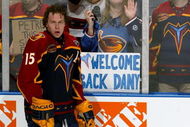ATLANTA - JANUARY 28:  Dany Heatley #15 of the Atlanta Thrashers skates during pre-game warmups of his first game back from injury as fans with signs supporting Heatley watch through the glass prior to the Thrashers against the St. Louis Blues January 28, 2004  at Philips Arena in Atlanta, Georgia.  (Photo by Jamie Squire/Getty Images)
