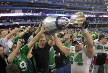 TORONTO - NOVEMBER 25:  Jeremy O'Day #54 of the Saskatchewan Rough Riders hoists the Grey Cup with fans in celebration of a 23-19 victory over the Winnipeg Blue Bombers during the 95th Grey Cup on November 25, 2007 at the Rogers Centre in Toronto, Ontario, Canada.  (Photo by Harry How/Getty Images)