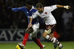 PORTSMOUTH, UNITED KINGDOM - DECEMBER 26:  Benjani of Portsmouth battles with Mathieu Flamini of Arsenal during the Barclays Premier League match between Portsmouth and Arsenal at Fratton Park on December 26, 2007 in Portsmouth, England.  (Photo by Bryn Lennon/Getty Images)