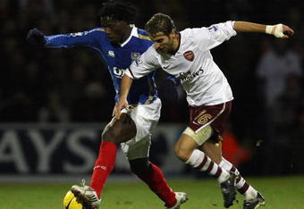 PORTSMOUTH, UNITED KINGDOM - DECEMBER 26:  Benjani of Portsmouth battles with Mathieu Flamini of Arsenal during the Barclays Premier League match between Portsmouth and Arsenal at Fratton Park on December 26, 2007 in Portsmouth, England.  (Photo by Bryn Lennon/Getty Images)