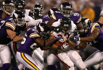MINNEAPOLIS - NOVEMBER 30:  Matt Forte #22 of the Chicago Bears is stopped by the defense  of the Minnesota Vikings at the Metrodome on November 30, 2008 in Minneapolis, Minnesota.  (Photo by Jonathan Ferrey/Getty Images)