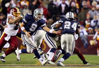 LANDOVER, MD - NOVEMBER 16:  Tony Romo #9 of the Dallas Cowboys hands the ball to teammate Marian Barber #24 during their game against the Washington Redskins on November 16, 2008 at FedEx Field in Landover, Maryland.  (Photo by Jim McIsaac/Getty Images)