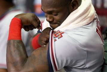 PHOENIX - MAY 08:  Elijah Dukes #34 of the Washington Nationals flexes as he sits in the dugout during the game against the Arizona Diamondbacks at Chase Field on May 8, 2009 in Phoenix, Arizona.  (Photo by Christian Petersen/Getty Images)