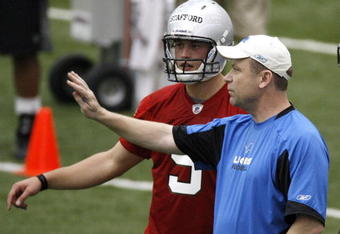 ALLEN PARK, MI - MAY 01: Offensive coordinator Scott Linehan of the Detroit Lions talks with Matthew Stafford #9 during rookie orientation camp at the Detroit Lions Headquarters and Training Facility on May 1, 2009 in Allen Park, Michigan.  (Photo by Gregory Shamus/Getty Images)