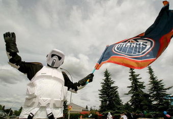 EDMONTON, AB - JUNE 17:  David Kho a fan of the Edmonton Oilers dressed as a 'Star Wars' Stormtrooper on I75 flies an Oilers flag before game six of the 2006 NHL Stanley Cup Finals against the Carolina Hurricanes on June 17, 2006 at Rexall Place in Edmonton, Alberta, Canada.   (Photo by Tim Smith/Getty Images)