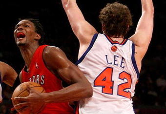 NEW YORK - JANUARY 11:  Chris Bosh #4 of the Toronto Raptors drives through David Lee #42  and Renaldo Balkman #32 of the New York Knicks on January 11, 2008 at Madison Square Garden in New York City. NOTE TO USER: User expressly acknowledges and agrees that, by downloading and/or using this Photograph, User is consenting to the terms and conditions of the Getty Images License Agreement.  (Photo by Nick Laham/Getty Images)