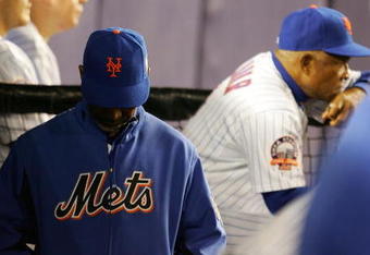 NEW YORK - SEPTEMBER 26:  Manager Jerry Manuel of the New York Mets walks through the dugout during his teams loss to the the Florida Marlins on September 26, 2008 at Shea Stadium in the Flushing neighborhood of the Queens borough of New York City.  (Photo by Jim McIsaac/Getty Images)