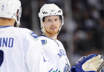 EDMONTON, AB - SEPTEMBER 22:  Mattias Ohlund #2 and Daniel Sedin #22 of the Vancouver Canucks look on in the third period against the Edmonton Oilers during an NHL preseason game on September 22, 2008 at Rexall Arena in Edmonton, Canada. The Canucks defeated the Oilers 4-3 in shootout overtime. (Photo by Jimmy Jeong/Getty Images)