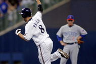 MILWAUKEE - SEPTEMBER 28:  Ryan Braun #8 of the Milwaukee Brewers celebrates his game winning two run home run against the Chicago Cubs in the eigth inning at Miller Park on September 28, 2008 in Milwaukee, Wisconsin. The Brewers defeated the Cubs 3-1 (Photo by Darren Hauck/Getty Images)