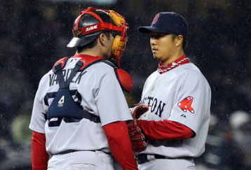 NEW YORK - MAY 05:  Jason Varitek #33 of the Boston Red Sox talks to teammate Hideki Okajima #37 against the New York Yankees on May 5, 2009 at Yankee Stadium in the Bronx borough of New York City. The Red Sox defeated the Yankees 7-3.  (Photo by Jim McIsaac/Getty Images)