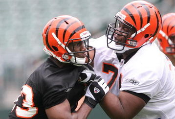 CINCINNATI, OH - MAY 1:  Cincinnati Bengals first round draft pick Andre Smith #71, right, battles withthird round draft pick Michael Johnson #93 during rookie minicamp at Paul Brown Stadium on May 1, 2009 in Cincinnati, Ohio.  (Photo by Mark Lyons/Getty Images)