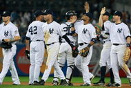 NEW YORK - JUNE 30: New York Yankees celebrate after winning 8-5 against the Seattle Mariners June 30, 2009 at Yankee Stadium in the Bronx borough of New York City. (Photo by Mario Tama/Getty Images)