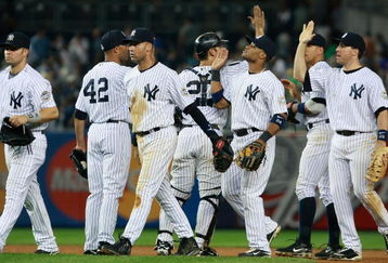NEW YORK - JUNE 30:  New York Yankees celebrate after winning 8-5 against the Seattle Mariners June 30, 2009 at Yankee Stadium in the Bronx borough of New York City.  (Photo by Mario Tama/Getty Images)