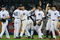 NEW YORK - JUNE 30:  New York Yankees celebrate after winning 8-5 against the Seattle Mariners June 30, 2009 at Yankee Stadium in the Bronx borough of New York City.  (Photo by Mario Tama/Getty Images)