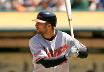 OAKLAND, CA - JUNE 07:  Nick Markakis #21 of the Baltimore Orioles bats against the Oakland Athletics at the Oakland Coliseum on June 7, 2009 in Oakland, California.  (Photo by Ezra Shaw/Getty Images)