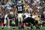 SOUTH BEND, IN - SEPTEMBER 30:  Quarterback Brady Quinn #10 of the Notre Dame Fighting Irish signals at the line of scrimmage next to offensive guard Bob Morton #76 against the Purdue Boilermakers September 30, 2006 at Notre Dame Stadium in South Bend, Indiana. Notre Dame won 35-21.  (Photo by Jonathan Daniel/Getty Images)