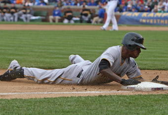 CHICAGO - MAY 27: Nyjer Morgan #3 of the Pittsburgh Pirates slides safely into third base on a 2-base error by Alfonso Soriano of the Chicago Cubs on May 27, 2009 at Wrigley Field in Chicago, Illinois. The Cubs defeated the Pirates 5-2. (Photo by Jonathan Daniel/Getty Images)