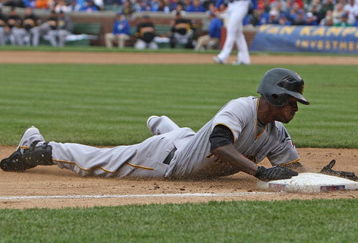 CHICAGO - MAY 27: Nyjer Morgan #3 of the Pittsburgh Pirates slides safely into third base on a 2-base error by Alfonso Soriano of the Chicago Cubs on May 27, 2009 at Wrigley Field in Chicago, Illinois. The Cubs defeated the Pirates 5-2. (Photo by Jonathan Daniel/Getty Images)