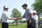 387831 20: Professional golfer Tiger Woods greets 16-year-old junior golfer L.C. Honore April 14, 2001 at the Coca-Cola Tiger Woods Foundation Junior Golf Clinic at the El Dorado Park Golf Course in Long Beach, CA. (Photo by Chris Weeks/Liaison)
