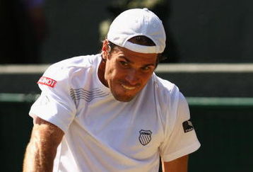 WIMBLEDON, ENGLAND - JULY 01:  Tommy Haas of Germany plays a backhand during the men's singles quarter final match against Novak Djokovic of Serbia on Day Nine of the Wimbledon Lawn Tennis Championships at the All England Lawn Tennis and Croquet Club on July 1, 2009 in London, England.  (Photo by Ian Walton/Getty Images)