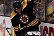 BOSTON - MAY 14: Erik Cole #26 of the Carolina Hurricanes Steve Montador #23 of the Boston Bruins are tangled up during Game Seven of the Eastern Conference Semifinal Round of the 2009 Stanley Cup Playoffs on May 14, 2009 at the TD Banknorth Garden in Boston, Massachusetts. The Hurricanes defeated the Bruins 3-2 in overtime. (Photo by Elsa/Getty Images)